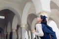 Tourism. Young woman traveler going sightseeing in Egypt. Girl walking on excursion looking at Al Salam mosque Royalty Free Stock Photo