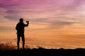 Tourist admiring breathtaking sunset views from the Mauna Kea, a dormant volcano on the island of Hawaii Royalty Free Stock Photo