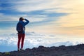 Tourist admiring breathtaking sunset views from the Mauna Kea, a dormant volcano on the island of Hawaii. Royalty Free Stock Photo