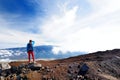 Tourist admiring breathtaking view of Mauna Loa volcano on the Big Island of Hawaii, USA Royalty Free Stock Photo