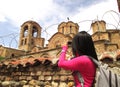 Tourist admiring Church of the Ljevisa Virgin in Prizren, Kosovo