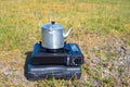 Tourist aluminum kettle on a gas stove Royalty Free Stock Photo