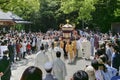 Tourist around men carrying an altar in Atsuta Shrine, Nagoya, Japan