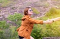 Tourist asian woman getting help to friend climb a rock,Helping hands,Overcoming obstacle concept Royalty Free Stock Photo