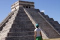Tourist attracted by the ancient Mayan pyramid and temple of Kukulkan at Chichen-Itza, next to the Mexican village of Piste Royalty Free Stock Photo