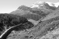 Tourist attraction Bernina train in the Swiss Alps near Alp GrÃÂ¼m