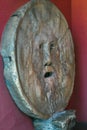 Tourist attraction carved stone human mask Bocca della Verita or pagan God Royalty Free Stock Photo