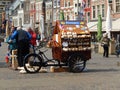 Bicycle cart with traditional wooden clogs on Market Square in Delft (Netherlands)