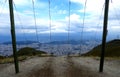 Swings looking over the city of Quito, Ecuador