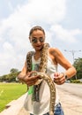 Tourist attraction, people/tourists petting a snake in Colombo, Sri Lanka, 2020 Royalty Free Stock Photo