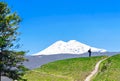 Tourist on the background of Mount Elbrus