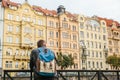 A tourist with a backpack on the backdrop of the old architecture in Prague in the Czech Republic. Travel, tourism Royalty Free Stock Photo