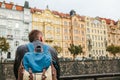 A tourist with a backpack on the backdrop of the old architecture in Prague in the Czech Republic. Travel, tourism Royalty Free Stock Photo