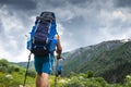 Tourist with backpack hike on mountain trek. Hiking in Svaneti, Georgia. Trekking in mountains Royalty Free Stock Photo