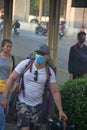 Tourist with a backpack in a medical mask