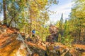 Tourist with a backpack on the rocks of Aigir. Bashkortostan. Royalty Free Stock Photo