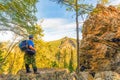 Tourist with a backpack on the rocks of Aigir. Royalty Free Stock Photo