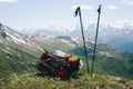 Tourist backpack and ski poles are lying on top Royalty Free Stock Photo