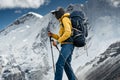 Solo hiker traveling among altitude cloudy mountains