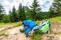 Tourist bagpack and krosna placed on the meadow near Maly Rozsutec mountain in Mala Fatra national park. Green and blue bags used