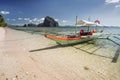 Tourist banca boat on island hopping trip. With beautiful scenery in background. Exotic nature in El Nido, Palawan Royalty Free Stock Photo