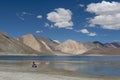 Tourist on the banks of pangong lake in ladakh, India