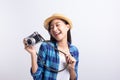 Tourist Beautiful of Asian woman holding a film camera  and smiling isolated on white background, Asia girl wear Plaid shirt and Royalty Free Stock Photo