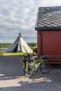 Tourist bicycle on the background of the traditional house of Sami, Finnmark, Norway Royalty Free Stock Photo