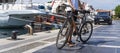 Tourist with bicycle on pier with yachts and boats at beautiful harbor of Port Turkey, Marmaris June 26, 2022