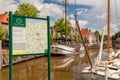 Tourist bicycle route information sign in the ancient Dutch city center of Dokkum, The Netherlands