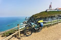 Tourist bike is parked on westernmost point of continent Europe.