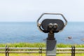 Tourist binocular over blue sea