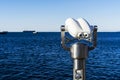 Tourist binoculars at sea pointed at sea Royalty Free Stock Photo