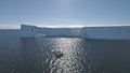 Tourist boat among Antarctica ocean. Aerial.