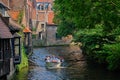 Tourist boat in canal. Brugge Bruges, Belgium Royalty Free Stock Photo