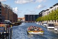 Tourist Boat in Christianshavn Canal in Copenhagen, Denmark Royalty Free Stock Photo
