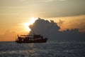 Tourist boat cruising against beautiful sunset sky Royalty Free Stock Photo