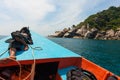 A tourist boat driver is napping on his boat in the sea of Phangan, Thailand