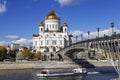 Tourist boat floats on the Moscow river on the background of the temple of Christ the Savior, Moscow