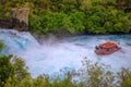 Tourist boat at Huka Falls, Waikato river, New Zealand