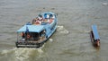 Tourist boat and longtail on Chao Phraya river