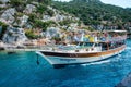 Tourist boat in Mediterranean sea. Excursion along shores of ancient sunken Lycian underwater city of Dolichiste on
