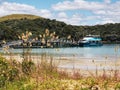 A tourist boat moored at a small harbour at Bay of Islands in New Zealand