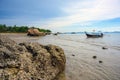 A tourist boat is moored in the water by the beach at Tup Kaek, Krabi, Thailand