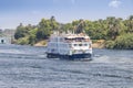 A Tourist boat motor down the River Nile towards Aswan in central Egypt. The tourist boats cruise between Luxor and Aswan in Royalty Free Stock Photo