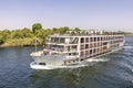 A tourist boat motor down the River Nile towards Aswan in central Egypt. The tourist boats cruise between Luxor and Aswan in Upper Royalty Free Stock Photo