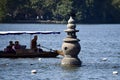 Tourist Boat near a Floating Stone Pagoda on The West Lake. Hangzhou, Zhejiang, China. October 28, 2018. Royalty Free Stock Photo