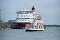 The tourist boat passes by the sea ferry `Gabriella`. Helsinki, Finland Royalty Free Stock Photo