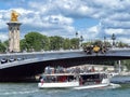 Tourist boat passing under the Alexander III bridge Pont Alexandre III Royalty Free Stock Photo