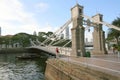 Tourist boat passing under historic bridge